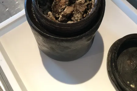 A tin jar containing what may be 340-year-old cheese recovered from the Kronan shipwreck.