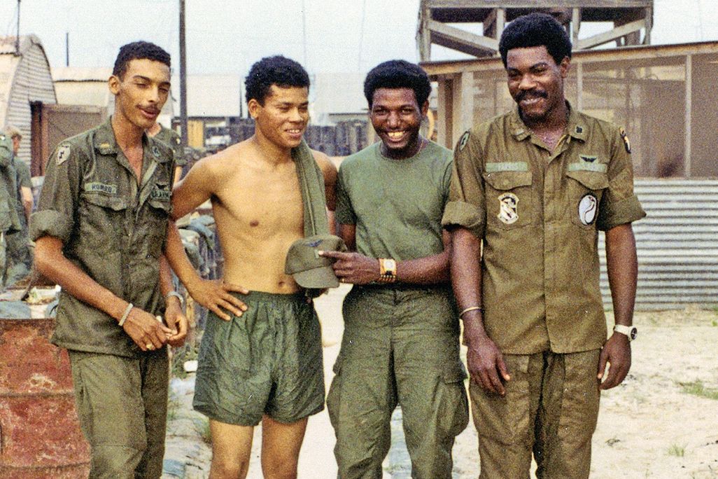 Clyde Romero, James Casher, Eldridge Johnson, and Bob Farris in military green