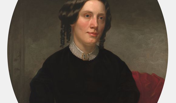 Oil painting portrait of Harriet Beecher Stowe seated with her hands folded in her lap.