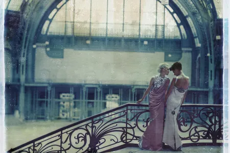 Cathleen Naundorf’s signature style celebrates the Grand Palais’ dramatic design and the “sculptural” details of two dresses from Chanel’s 2010 collection.