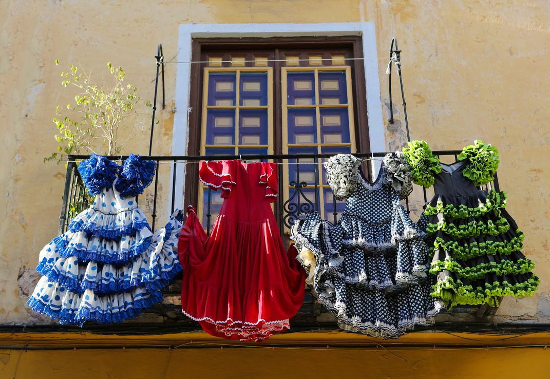 Flamenco dresses on a balcony in Málaga