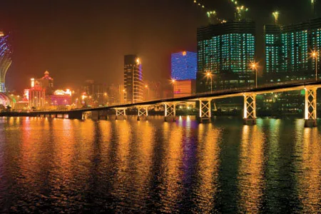 A view of Macau at night and the tail of the Dragon's bridge show a skyline full of potential and color as buildings continue to arise on reclaimed land