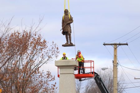 Workers removing the statue of Ambrose P. Hill from its pedestal in Richmond, Virginia, on December 12