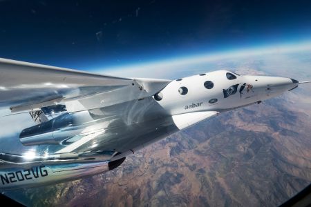 Spaceship Unity, carried by Virgin Galactic's mother ship and piloted by Mark Stucky and Dave Mackay, makes its first flight over the Mojave desert on September 8, 2016.