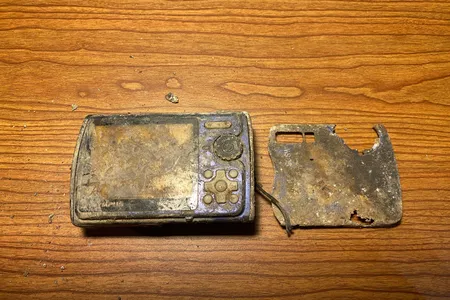 The Olympus digital camera was covered in mud and broken after spending 13 years in Colorado&#39;s Animas River, but Spencer Greiner was still able to pull photos off its memory card.