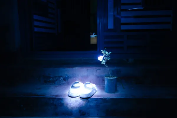 His sandals rest at the door like a memory still trying to come home. thumbnail