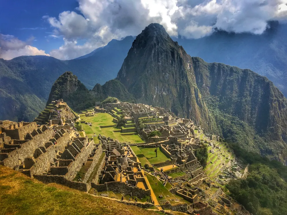 Panoramic View Of Machu Picchu Against Cloudy Sky