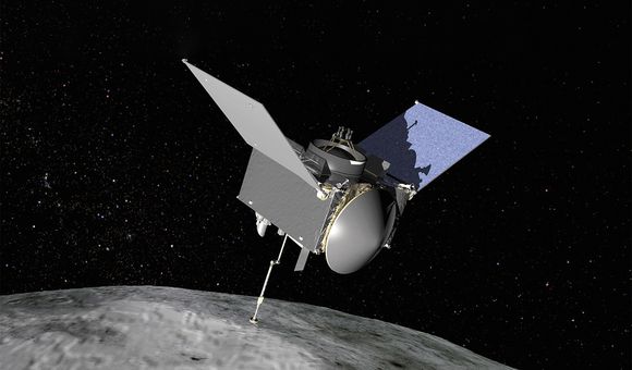 An uncrewed spacecraft with three main components is seen orbiting above an asteroid.