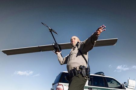 Mesa County deputy Derek Johnson launches a Falcon. The sheriff’s office uses UAVs mainly for crime scene photography and search-and-rescue.