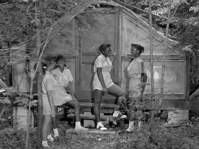African-American Girl Scouts chat at a camp named after Josephine Holloway, who pioneered scouting for girls of color.
