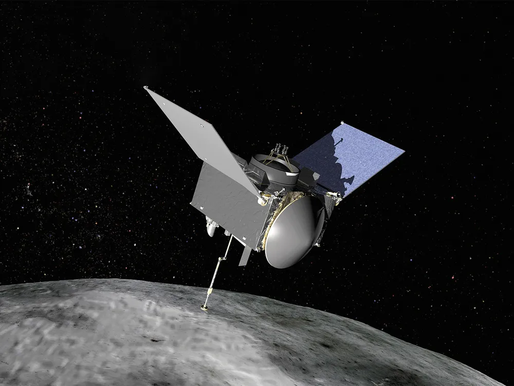An uncrewed spacecraft with three main components is seen orbiting above an asteroid.