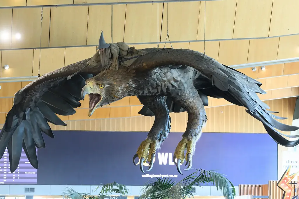 Giant eagle sculpture with wizard flying on its back