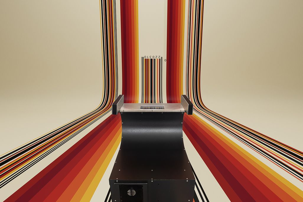 A Spectra Physics Model A supermarket scanner—one of the first ten ever produced. A laser within the unit projects a beam onto a mirror that redirects it through the glass plate on the top.