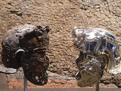 See a Restored Ancient Roman Helmet—and Two Shiny New Replicas image