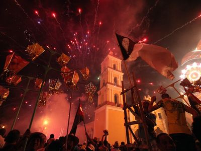 People launch fireworks during the traditional celebrations of Parrandas in Remedios, Cuba, December 25, 2013.