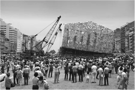 Argentinians look on as Marta Minují's 1983 Parthenon of books is removed with a crane. The artist will recreate her installation on a grander scale in Germany next year. 