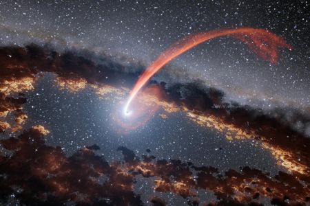An artist’s illustration of a black hole “eating” a star.