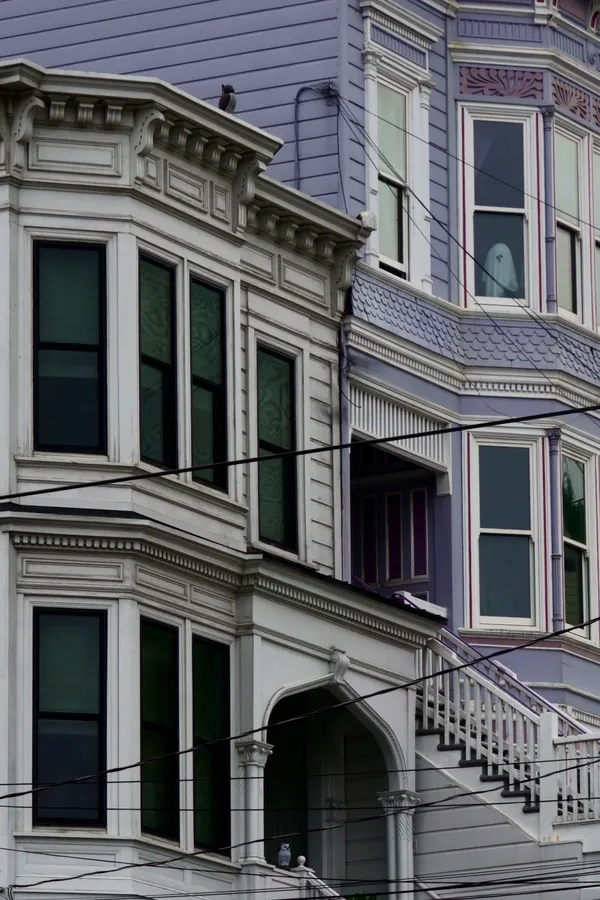 Tiny ghost looking down on me in the streets of San Fancisco thumbnail