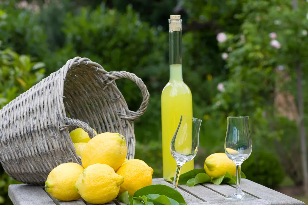 Lemons and traditional limoncello aperitif, Amalfi Coast