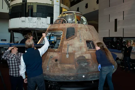 The Apollo 11 Command Module Columbia undergoes a scanning process for the creation of a 3-D model.