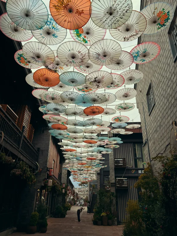 Chinese oiled paper umbrella street thumbnail