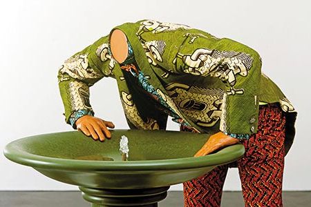 Artist Yinka Shonibare's Headless Man Trying to Drink sculpture alludes to the growing shortage of potable water worldwide.