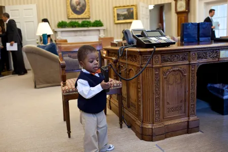 Corbin Fleming plays with President Obama's desk phone in 2012.  