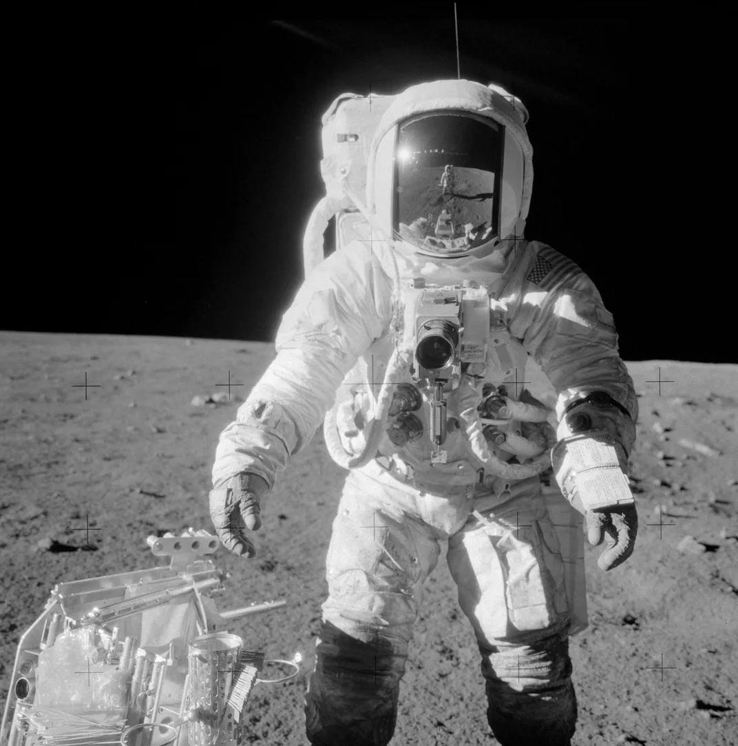 Alan L. Bean, lunar module pilot on the Apollo 12 mission, with a sample collection bag, as photographed by Conrad.