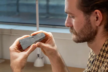 Archaeologists discovered a fragment of a reusable slate tablet with letters scratched into the surface.