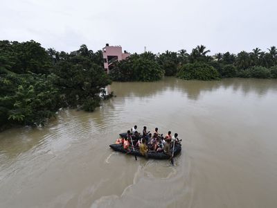 Residents evacuate their homes in Chennai during catastrophic floods. 