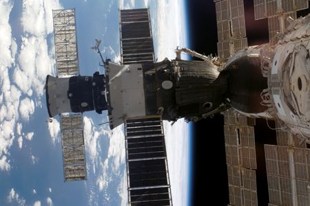 Safe harbor: A Soyuz (foreground) and Progress supply vehicle docked to the International Space Station in August 2007.