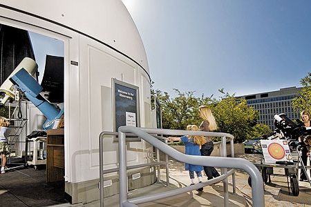 With telescopes both inside and out, Museum educators use a variety of filters to show visitors spots on the sun, craters on the moon, and the phases of Venus.