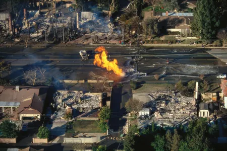 Not a movie still: Fire rages on a flooded street following the 1994 Northridge earthquake in California.