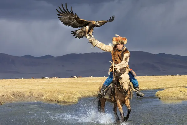 Eagle Hunter Crossing the River, Mongolia thumbnail