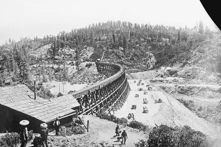 Chinese laborers at work with pick and shovel wheelbarrows and one horse dump carts filling in under the long secret town trestle which was originally built in 1865 on the Present Souther Pacific Railroad lines of Sacramento. 