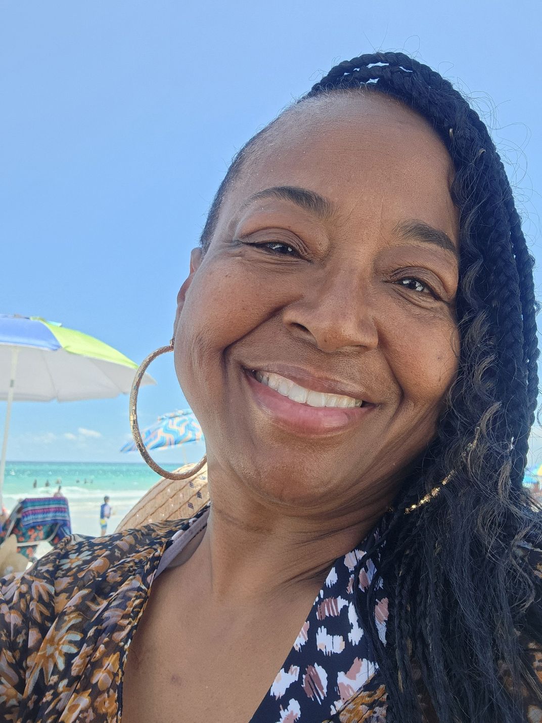 Photo of Black woman smiling into the camera