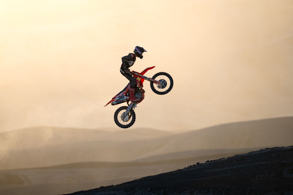 A biker flies high with his dirt bike in Utah.