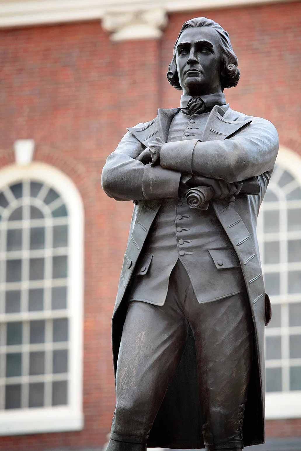 a bronze statue of Samuel Adams in Boston