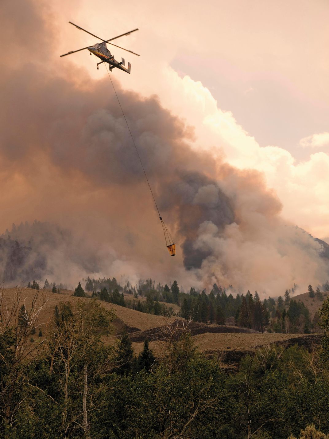 A crewed K-MAX auditions as a firefighter in Idaho in 2013. Drone K-MAXs have yet to fight real wildfires.