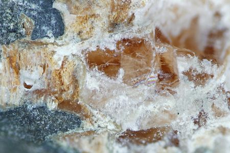 Parisite-(La), a carbon-bearing mineral that was predicted by computer model before it was discovered.