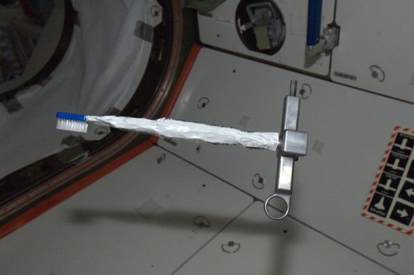 A toothbrush floats in the International Space Station.