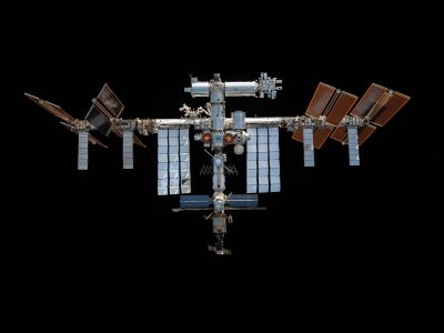 This mosaic depicts the International Space Station as pictured from the SpaceX Crew Dragon Endeavour in November 2021.