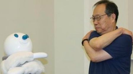 Taizo the robot gets seniors to exercise.