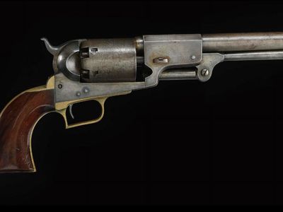 This six-shooter, in the collection of the National Museum of American History, is not the very first Colt six-shooter, but an updated, slightly lighter version Colt produced between 1848 and 1861.