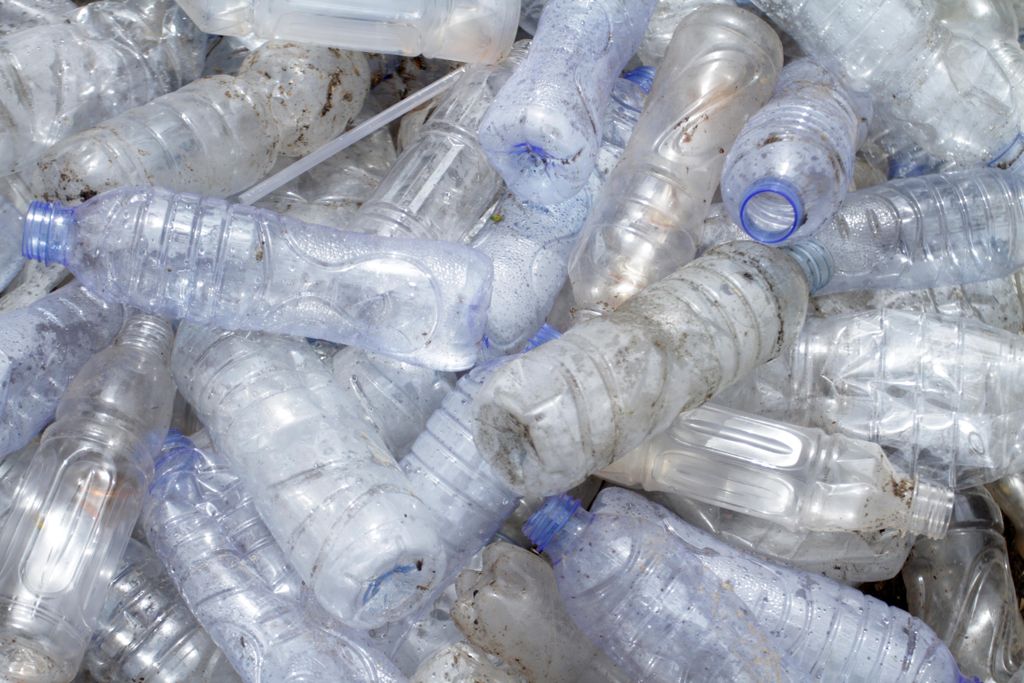 A pile of empty plastic, unlabeled water bottles