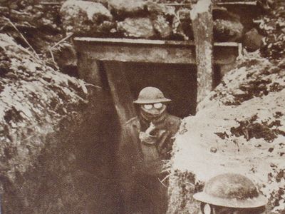American soldier wearing gas masks in the trenches during World War I