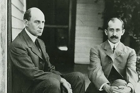 Orville Wright (seated at right, with Wilbur) wears what’s known as “the Chevron,” a thick mustache that covers the top of the upper lip. 
“He had sported a reddish mustache since high school,” writes Tom Crouch in his 2003 book The Bishop’s Boys. “Once full, almost a handlebar, it was now clipped short, just bushy enough to cover a pair of very thin lips that turned up at one corner when he smiled. He was the enthusiast of the pair, ever on fire with new inventions, and the optimist as well, the one who always saw the brighter side.”
There was a (small) outcry when Orville didn't make The Art of Manliness’ list of “35 Manliest Mustaches of All Time.” The father of aviation lost out to a puppet—the Swedish Chef from "the Muppet Show"—and a cartoon character, Yosemite Sam.