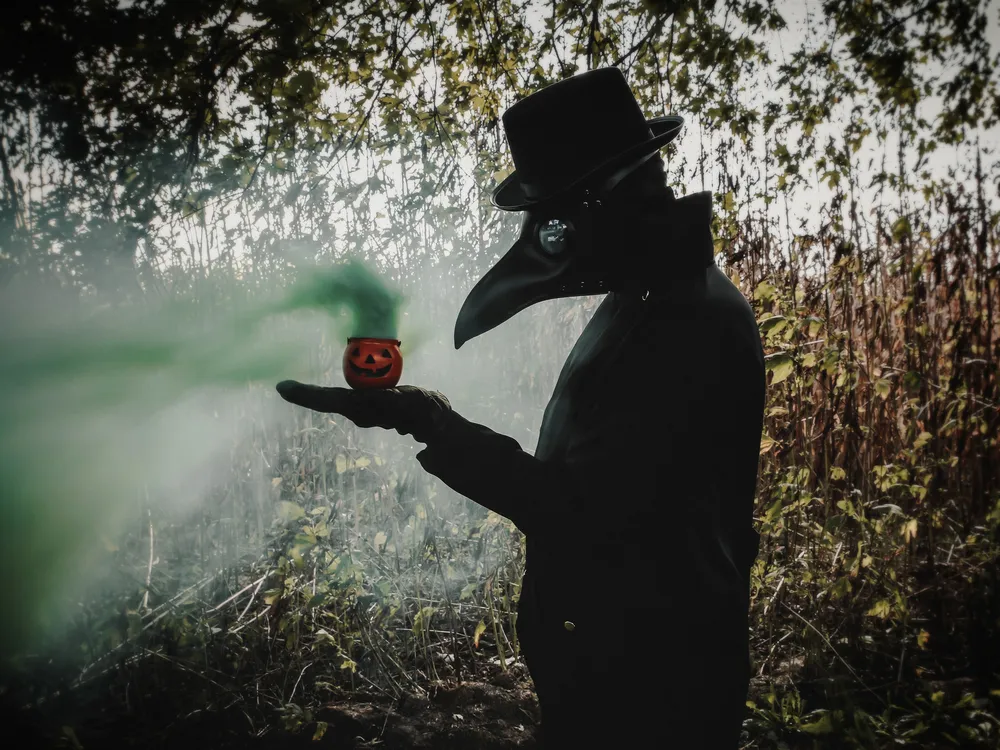 OPENER - The green gas emanating from this small jack-o’-lantern alludes to the spread of Covid-19. Fittingly, the photographer’s subject dons a beaked mask based on the ones worn by physicians treating bubonic plague victims in 17th-century Europe.