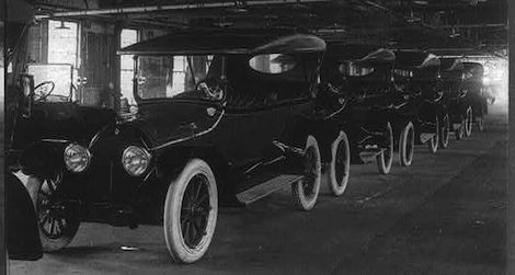 A row of brand new Cadillacs awaits drivers. 1917