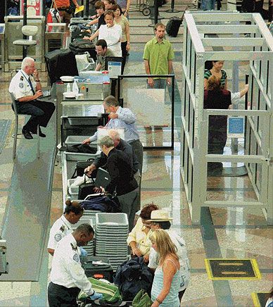 Right of Passage: In contrast to the early days of commercial airline travel, today, airport security officers screen passengers and their carry-on baggage in an effort to prevent attacks.